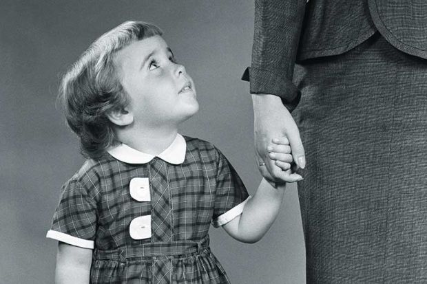 Child holding mother's hand