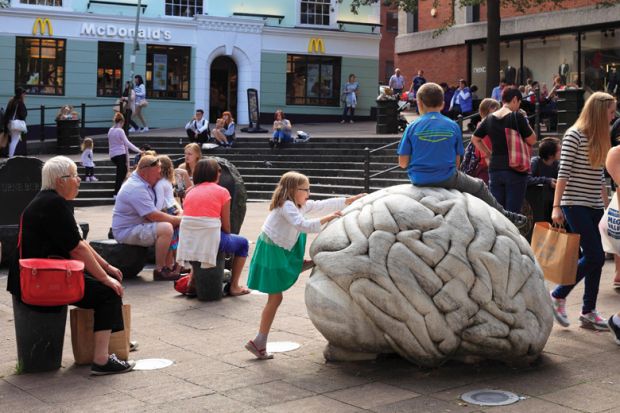 Children climbing on sculpture by-Anne and Patrick Poirier, Norwich, Norfolk