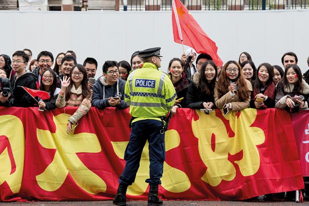 Chinese students show support for Chinese President Xi Jinping as he arrives to tour the National Graphene Institute at Manchester University in 2015 Chinese students show support for Chinese President Xi Jinping as he arrives to tour the National Graphene Institute at Manchester University in 2015