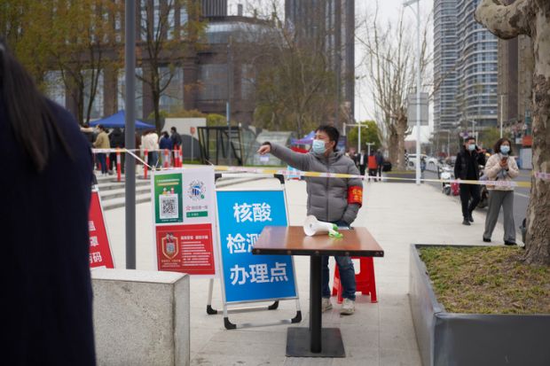 City Nantong in Jiangsu province in China, March 31 2022 government doing mass Covid-19 testing for Omicron. People line up for the registration and test