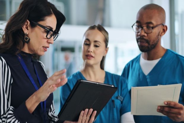 Medical scientists discuss results, illustrating clinical trials Medical scientists discuss results, illustrating clinical trials