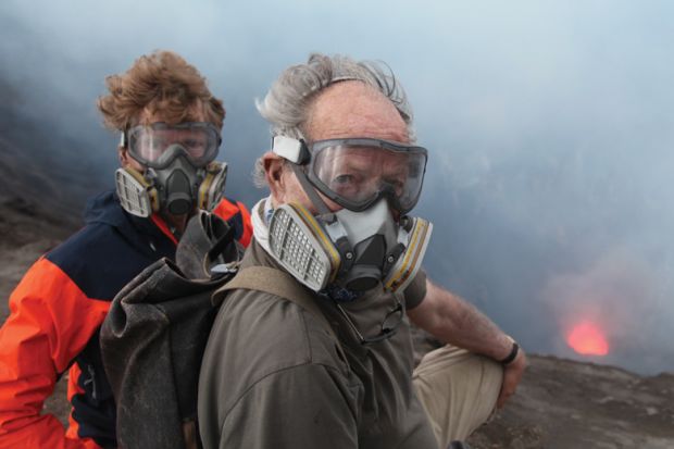 Clive Oppenheimer and Wwerner Herzog standing beside volcano Clive Oppenheimer and Wwerner Herzog standing beside volcano