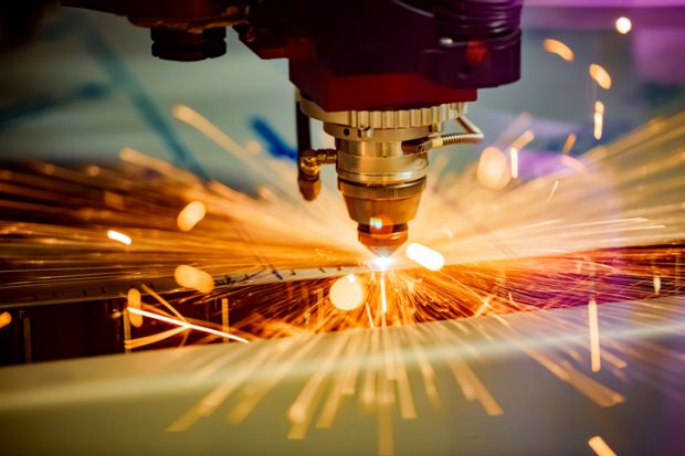 CNC Laser cutting of metal, modern industrial technology.
