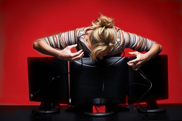 Woman leaning over computer