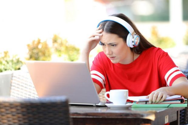 Confused student listens to online lecture