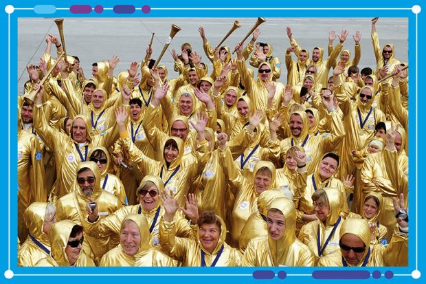 Crowd of people wearing gold suits, to illustrate the success at Johns Hopkins University in winning research grants Crowd of people wearing gold suits, to illustrate the success at Johns Hopkins University in winning research grants