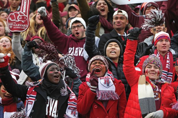 Crowd of Harvard University students cheering American football game Crowd of Harvard University students cheering American football game