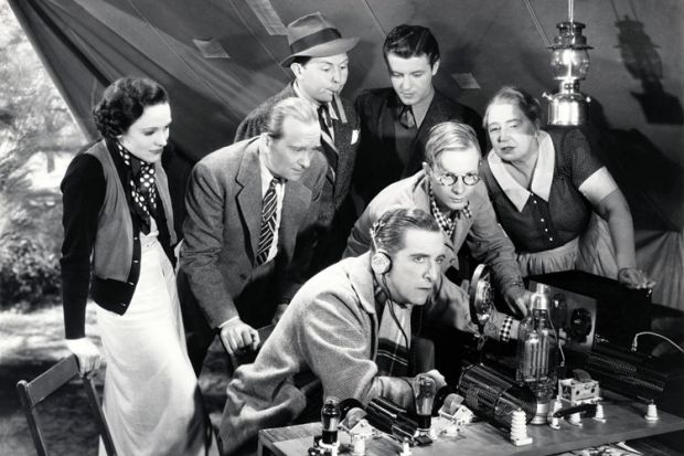 Crowd of people listening to-two way radio