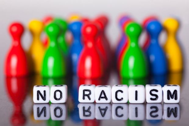Cube letters show the words No Racism