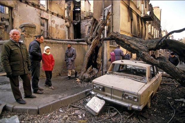 Destructions around the Parliament, with a Lada car damaged by a fallen tree,, Tbilisi, Georgia, 1992. As an illustration for whether massification has driven UK higher education to the end of the road. Destructions around the Parliament, with a Lada car damaged by a fallen tree,, Tbilisi, Georgia, 1992. As an illustration for whether massification has driven UK higher education to the end of the road.