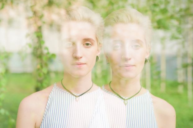 Double exposure of woman's face