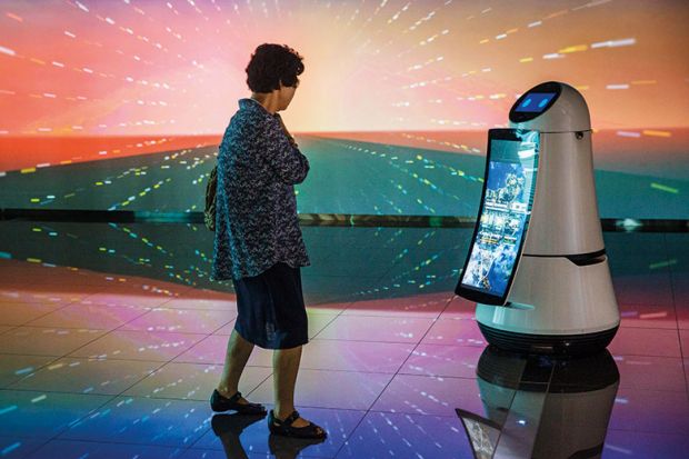 Woman looking at robot Woman looking at robot