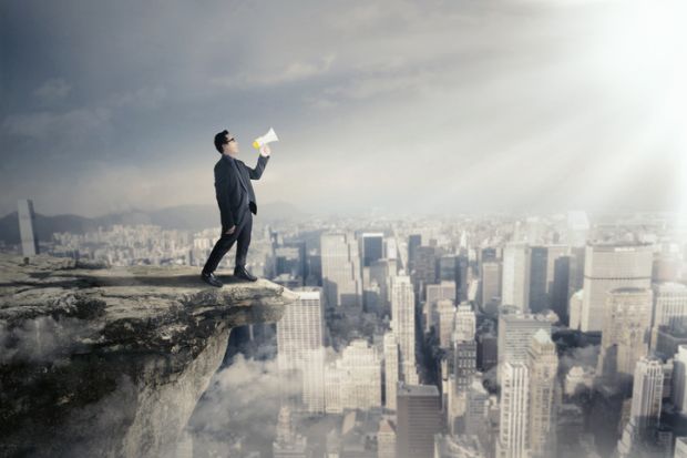 A man with a megaphone on a rooftop, symbolising free speech
