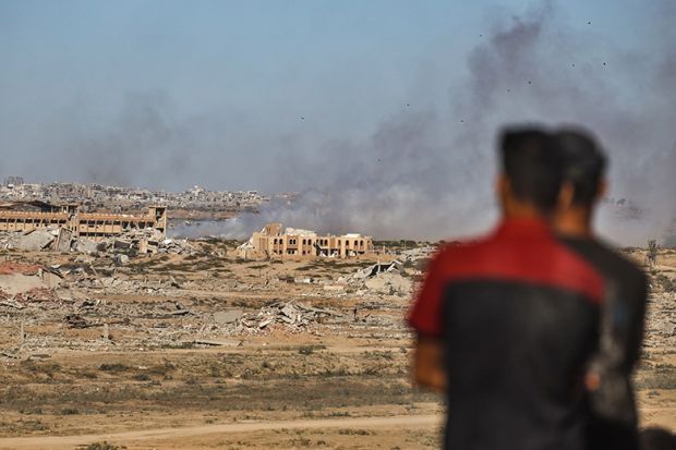  Smoke rises from destroyed buildings as Palestinians continue to flee northern Gaza following heavy Israeli attacks, in Gaza City, Gaza on 1 October, 2025.