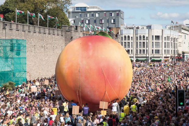 Giant peach being moved through Cardiff streets Giant peach being moved through Cardiff streets