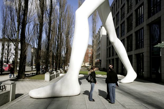 Giant statue stands over crowd Giant statue stands over crowd
