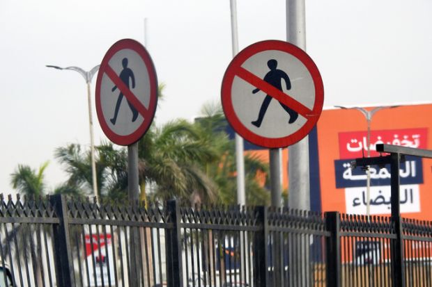 Giza, Egypt, December 30 2021 Prohibition No Pedestrian Sign, no entry sign, a warning sign not to cross the road, selective focus of not to cross or walk the road