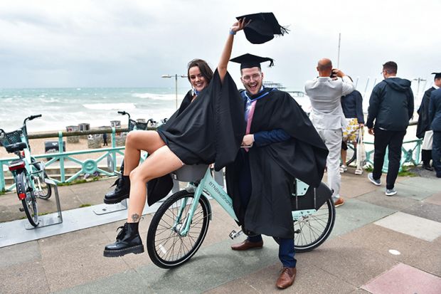 Students celebrate their success on graduating from the University of Brighton on a windy seafront after the ceremony. As an illustration that the public perception of 'graduate regret' is overestimated. Students celebrate their success on graduating from the University of Brighton on a windy seafront after the ceremony. As an illustration that the public perception of 'graduate regret' is overestimated.