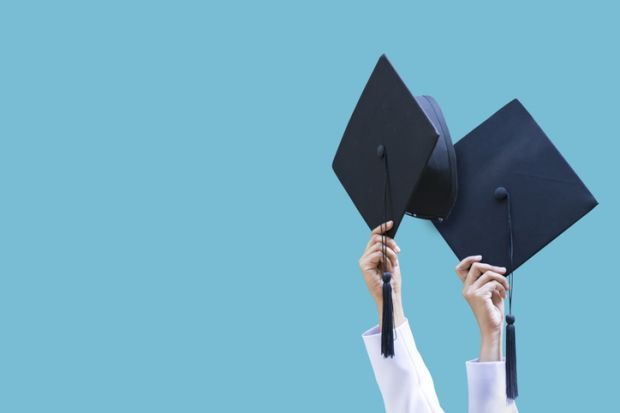 Graduation caps thrown