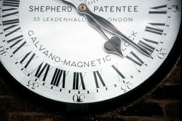 Greenwich, London, UK - July 15th 2006 Fragment of the Galvano-Magnetic clock (Sephered) in the wall of Greenwich Observatory, with 24-hour and Roman numerals.