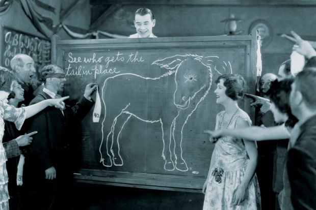 Group playing pin the tail on the donkey Group playing pin the tail on the donkey