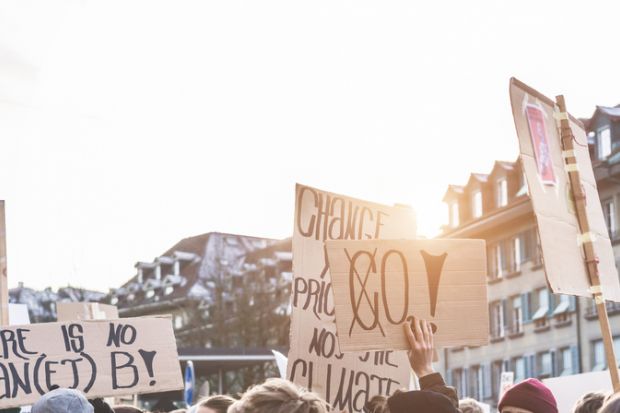 Group of demonstrators fight for climate change action Group of demonstrators fight for climate change action
