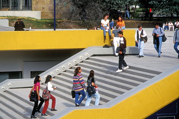 Students walking up stairs on campus Students walking up stairs on campus