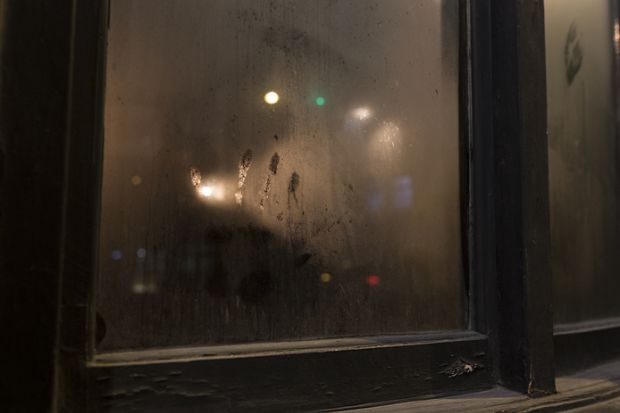 Handprint On Smoked Pub Window Glass