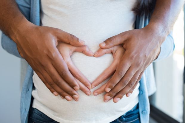 Hands on pregnant tummy