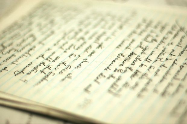 Handwritten essay on table Handwritten essay on table