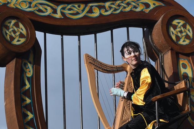 Irish harp player at St Patrick’s Day Parade in Dublin to illustrate Ireland’s search for global research talent Irish harp player