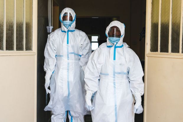 Health workers wearing protective clothing Health workers wearing protective clothing