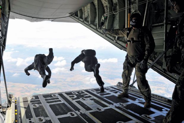 High-altitude, low-opening (HALO) paratroopers jumping from aircraft High-altitude, low-opening (HALO) paratroopers jumping from aircraft