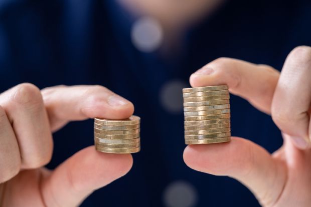 Holding two coin stacks Holding Two Coin Stacks