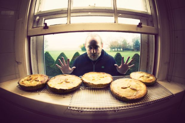 Hungry man looking longingly at row of pies Hungry man looking longingly at row of pies