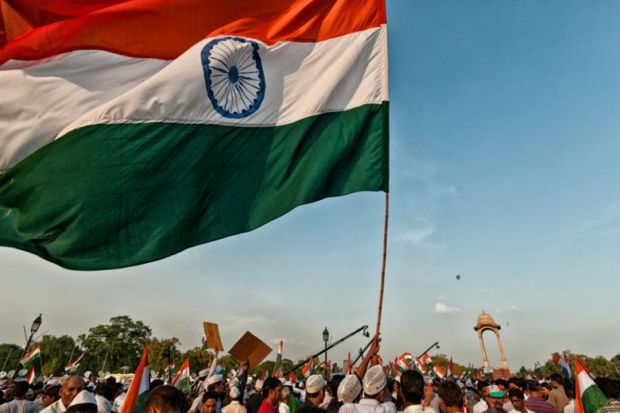 Indian flag being waved by demonstrators during protest Indian flag being waved by demonstrators during protest