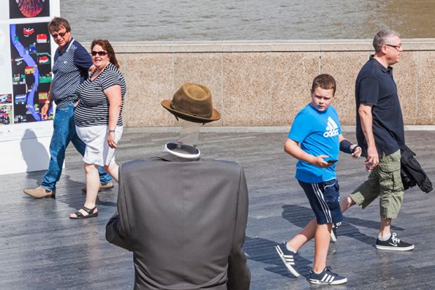 Invisible man busker, Bankside, London. To illustrate that master’s loans have been ‘forgotten’ in student debt debate.