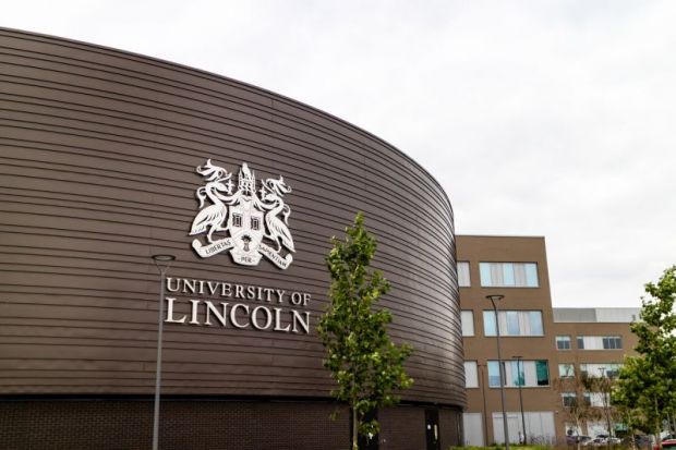 The University of Lincoln logo on one of the buildings.