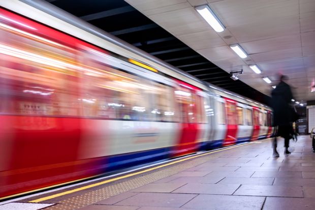 Lack of commute is a factor in academics reporting satisfaction with homeworking. A London Underground train speeds through a station. Lack of commute is a factor in academics reporting satisfaction with homeworking.