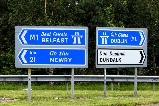Road signs point to places in Northern Ireland one way and the Republic the other Road signs point to places in Northern Ireland one way and the Republic the other