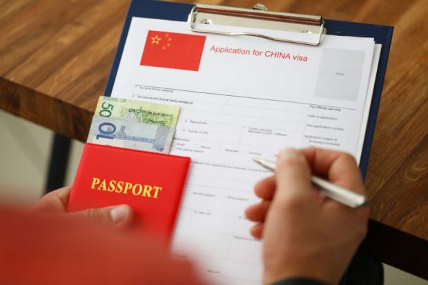 Filling out a Chinese visa application form 
