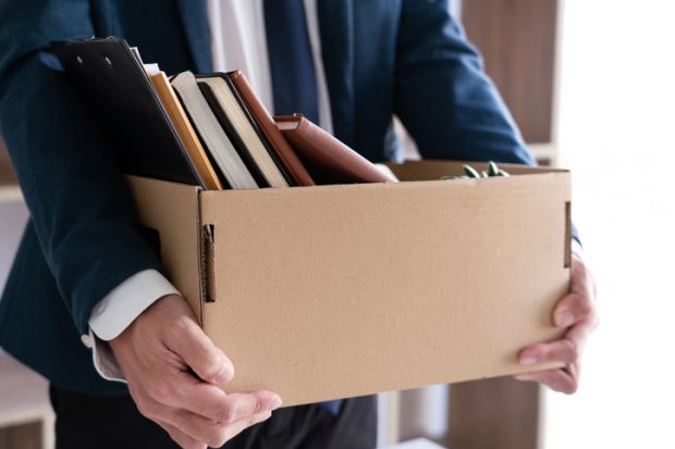 Midsection Of Man Holding Box