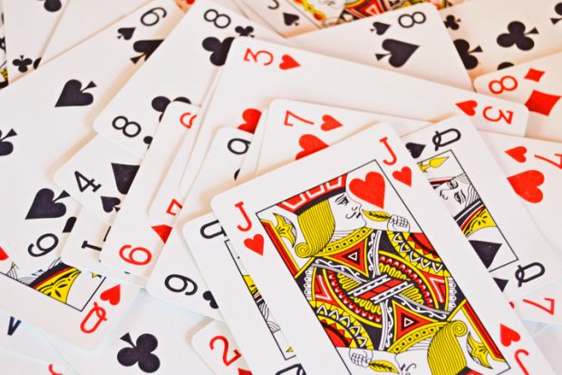 Playing cards randomly piled, with J on top Playing cards randomly piled, with J on top