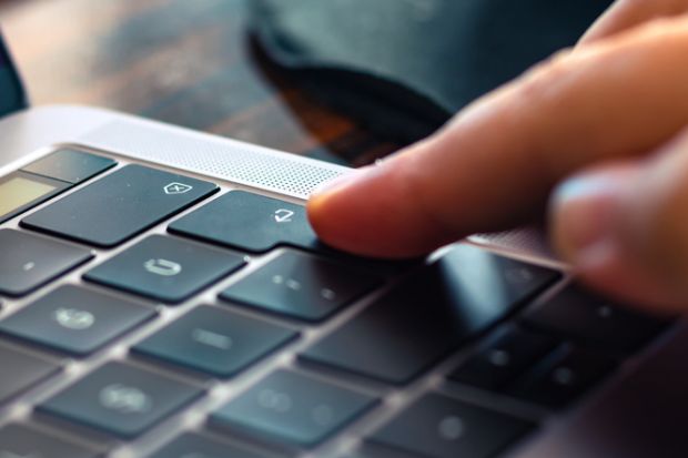 Pressing Enter button on the keyboard of laptop.