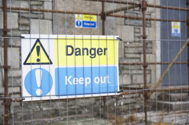 "Danger - keep out" sign on construction site