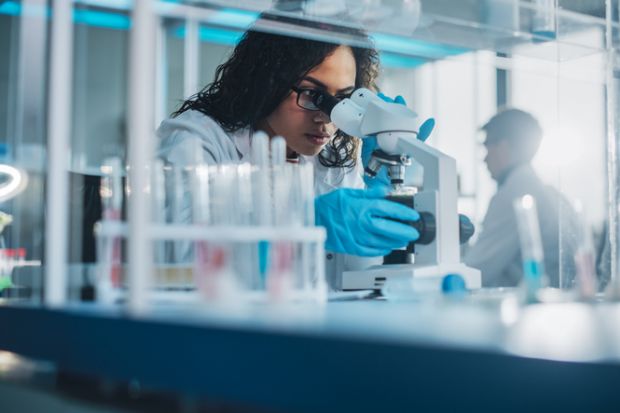 Biotechnology specialist working with advanced equipment