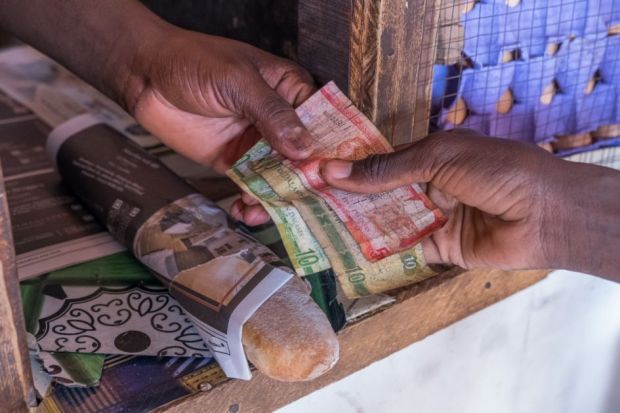 Scene with payment of money in a shop Scene with payment of money in a shop