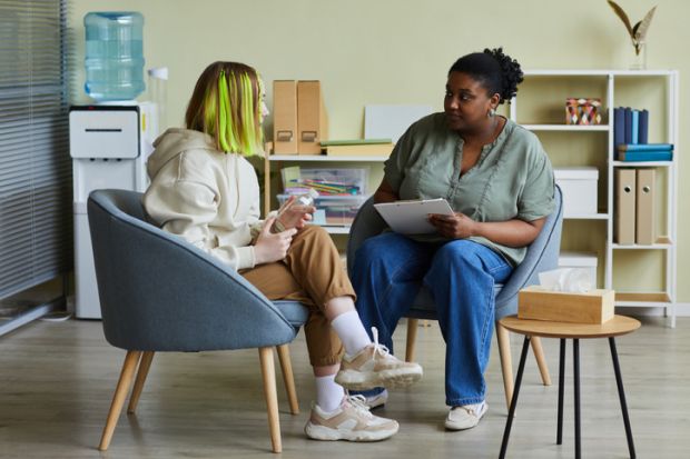 A counsellor talks to a student A counsellor talks to a student