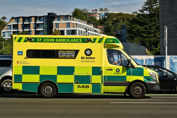 St John ambulance in traffic with driver