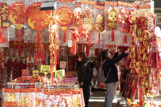 To celebrate the coming Chinese New Year outdoor shopping stalls place red goods representing luck for sale. To celebrate the coming Chinese New Year outdoor shopping stalls place red goods representing luck for sale.